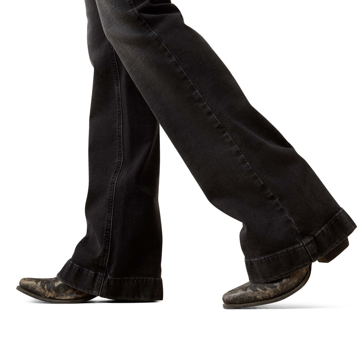 Black jeans and brown boots on a white background