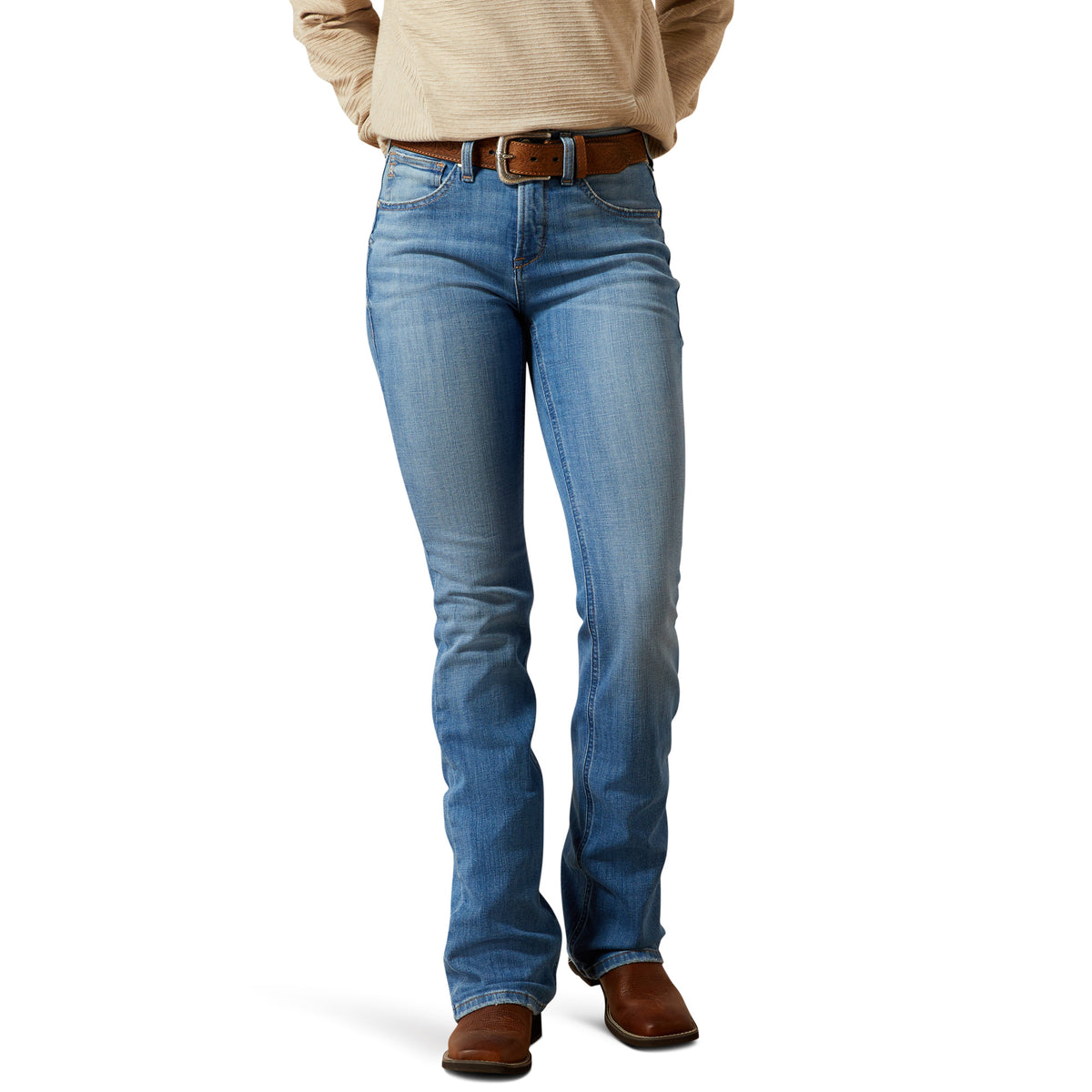 Person wearing blue jeans and a beige jacket on a white background