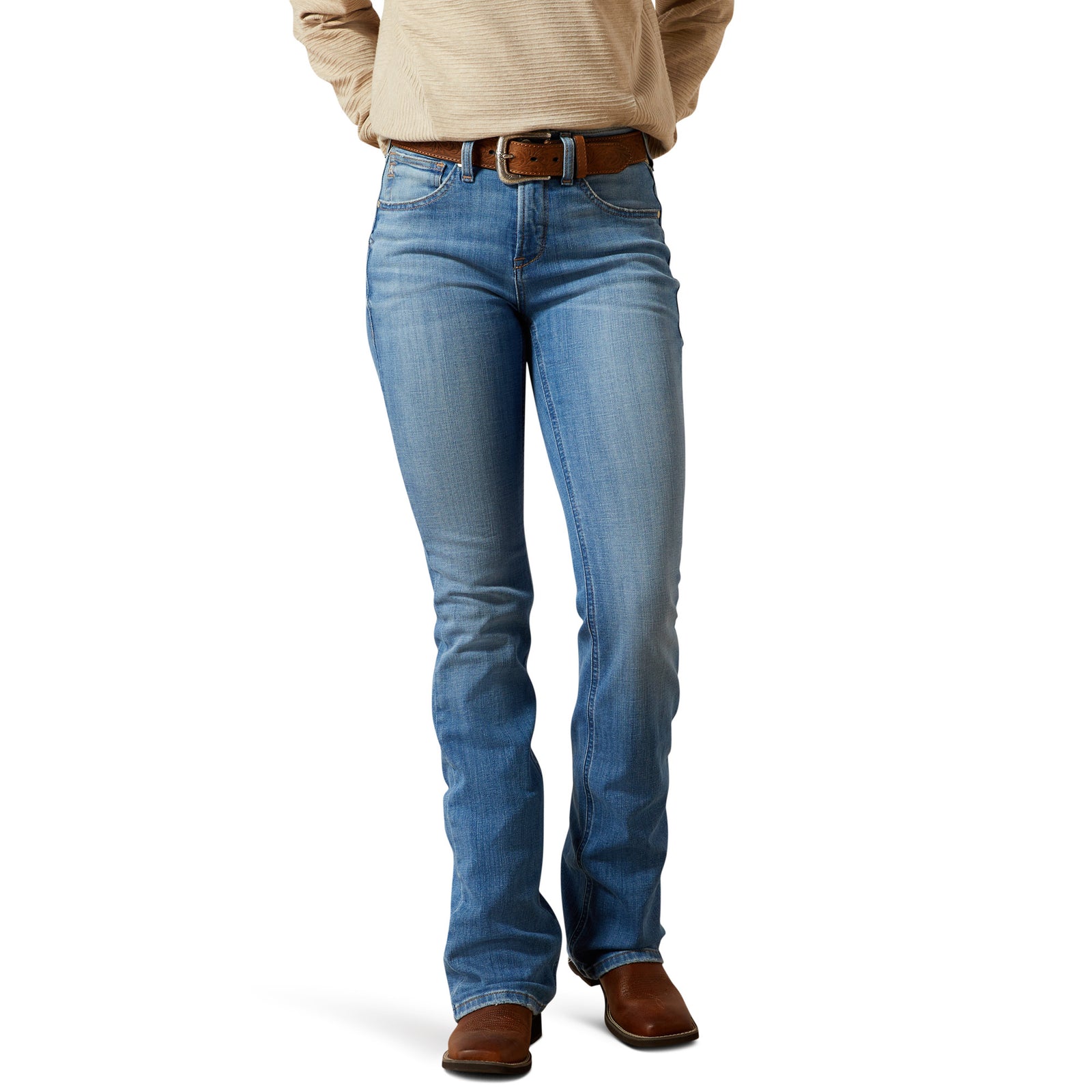 Person wearing blue jeans and a beige jacket on a white background