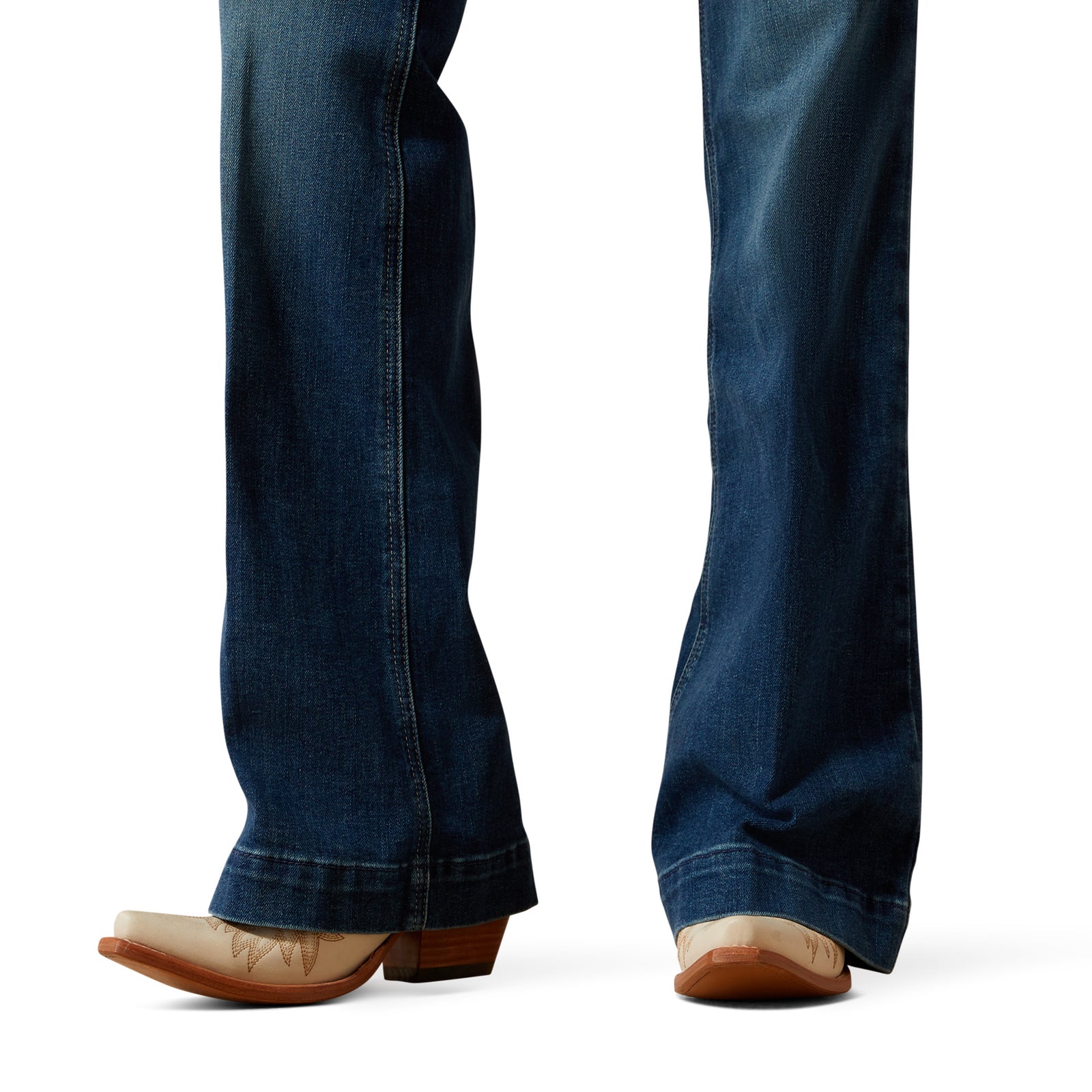 Blue jeans worn by a person on a white background