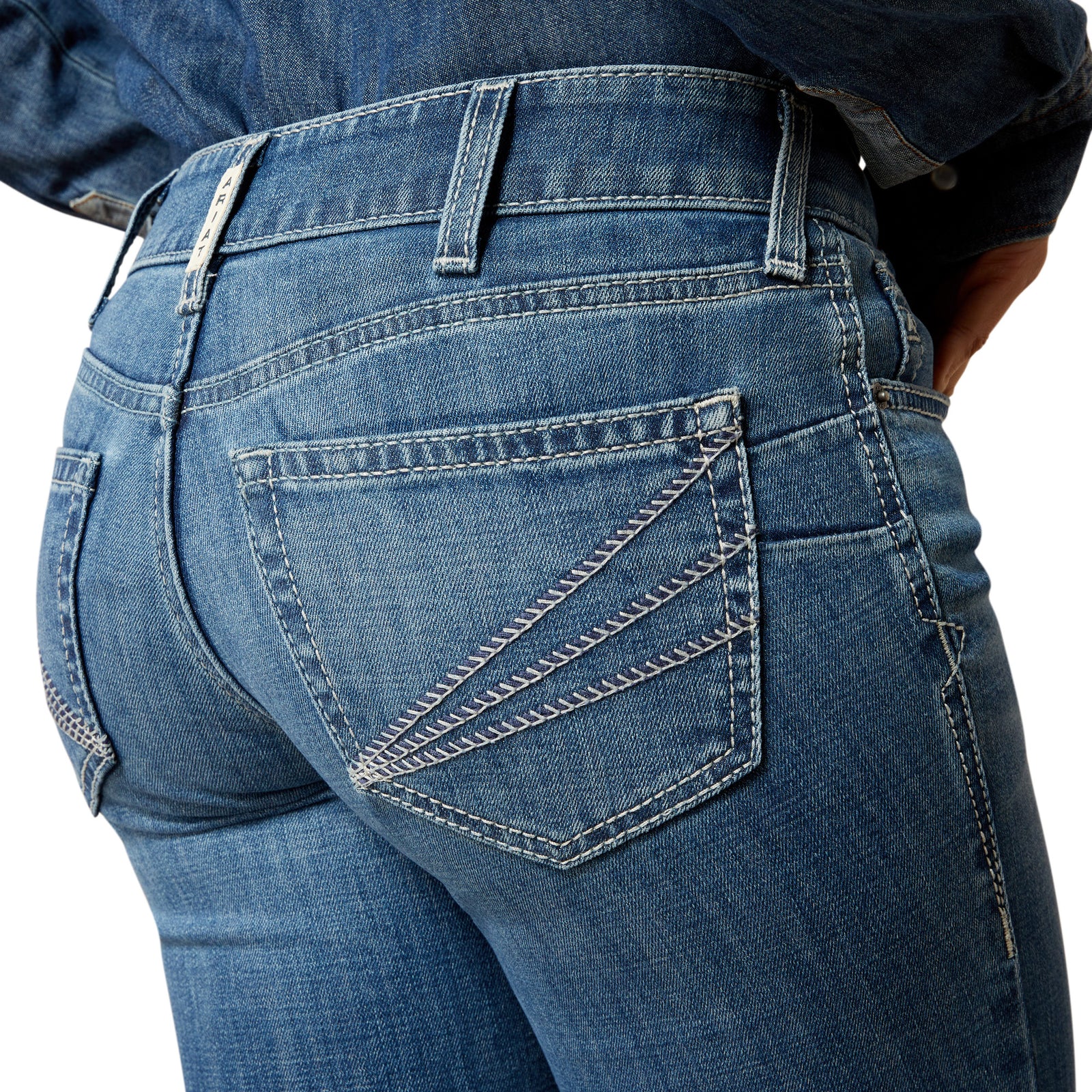 Close-up of blue jeans with a white background