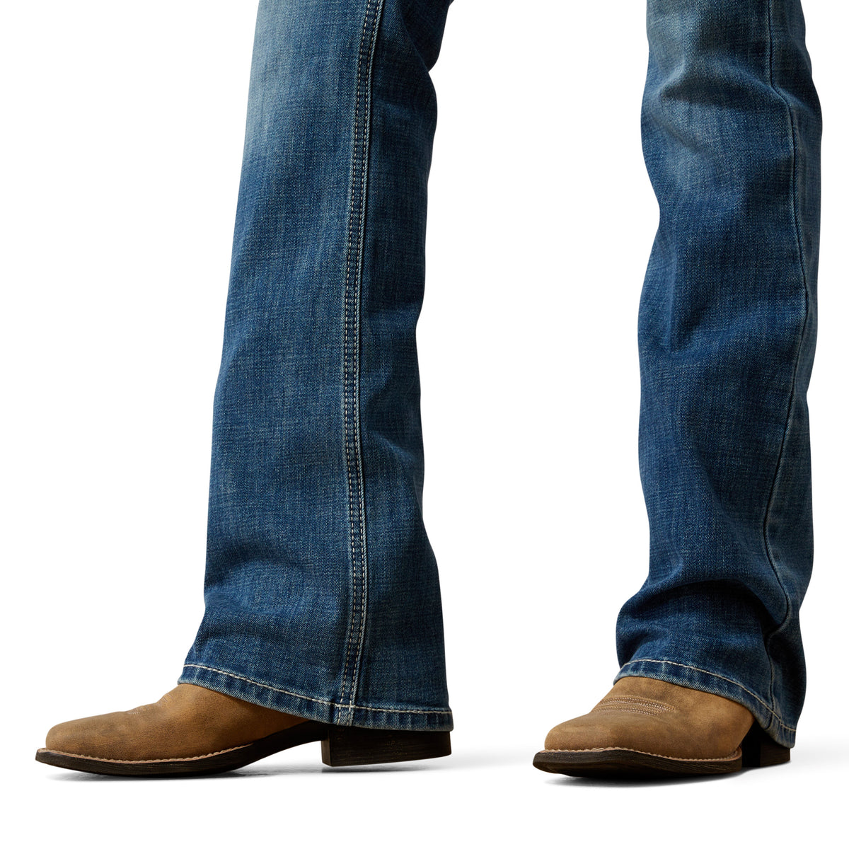Blue jeans and brown boots on a white background