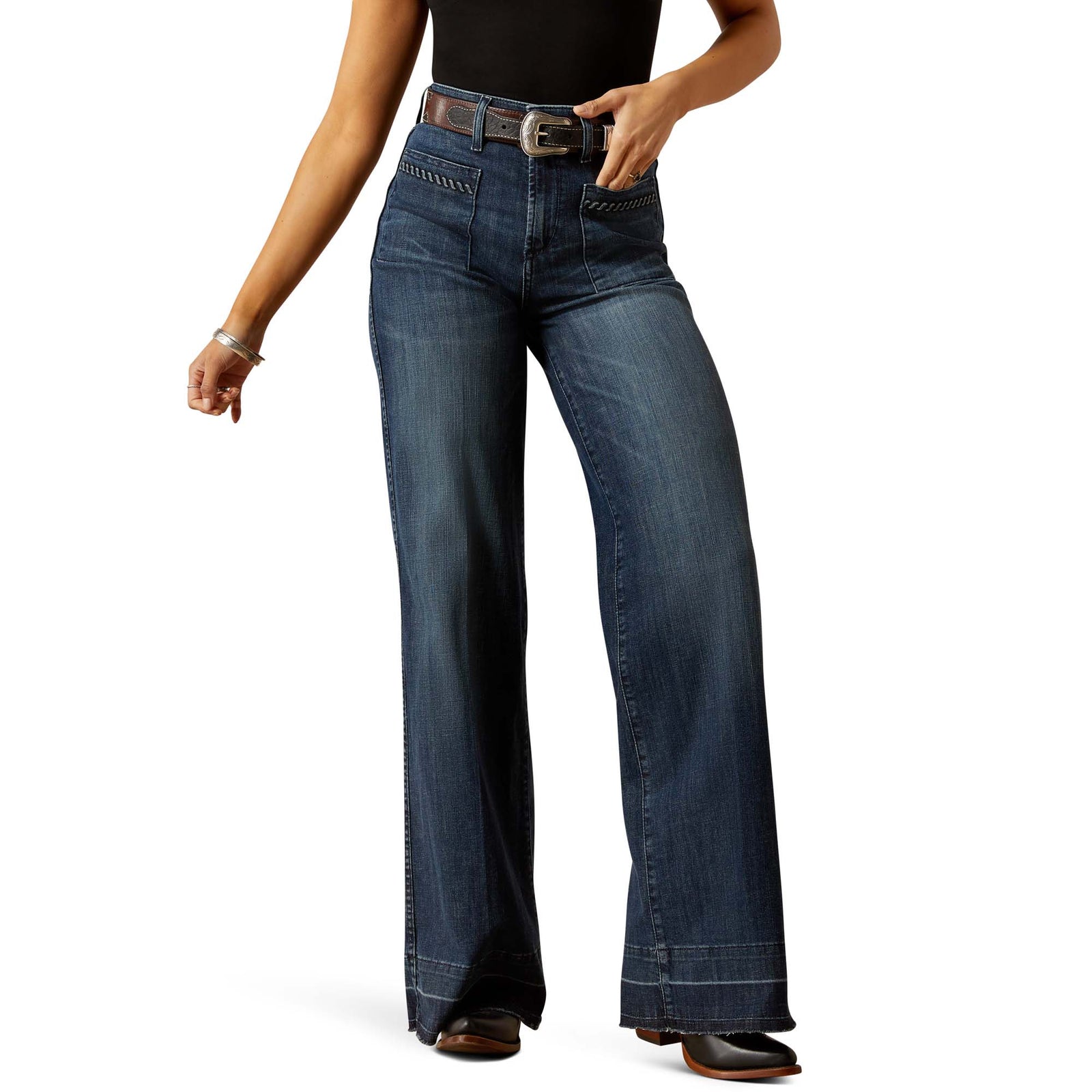 Person wearing blue jeans on a white background