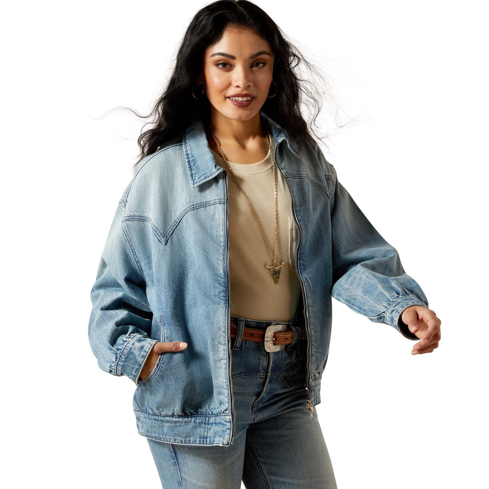 Woman wearing a denim jacket on a white background