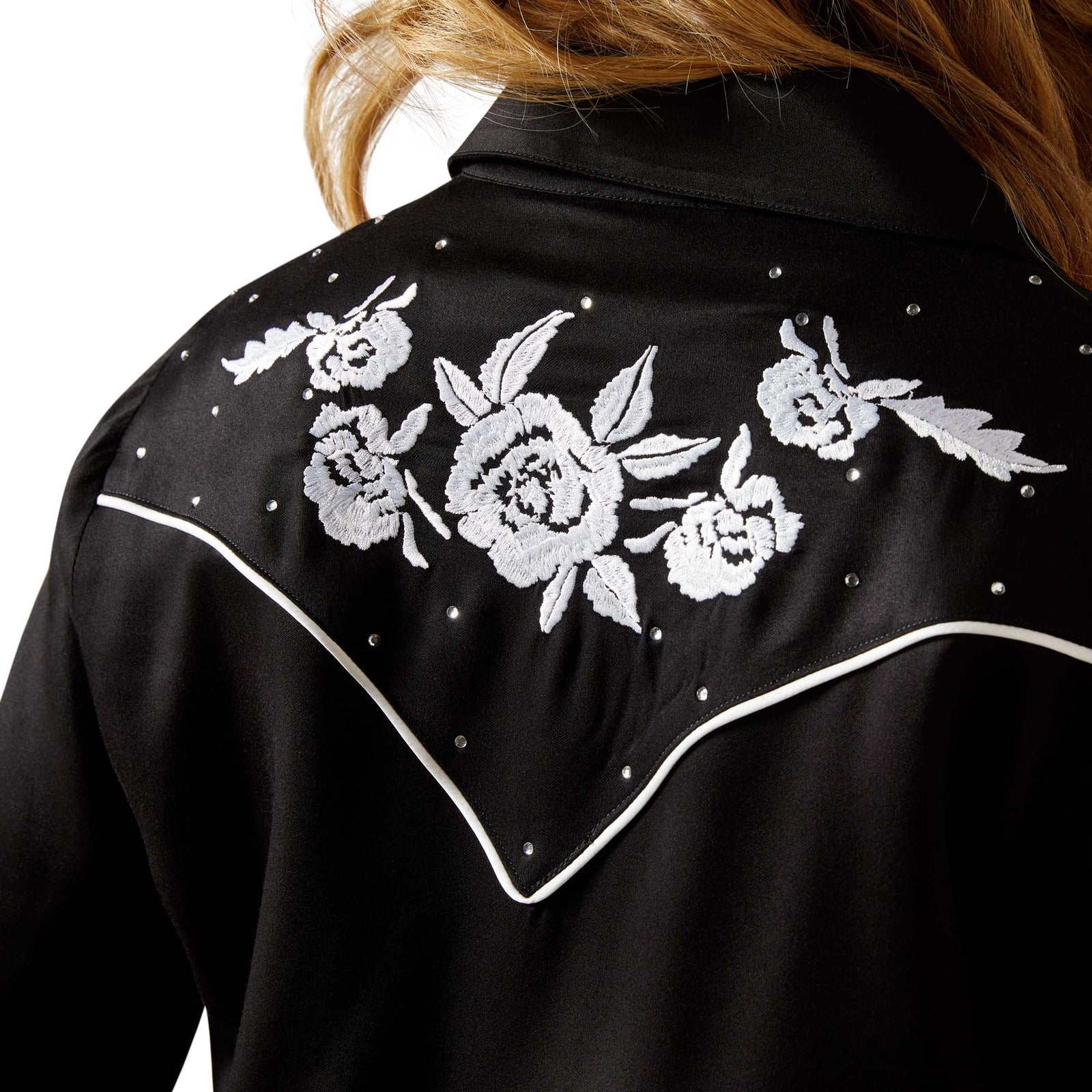 Black jacket with white floral embroidery on a plain background