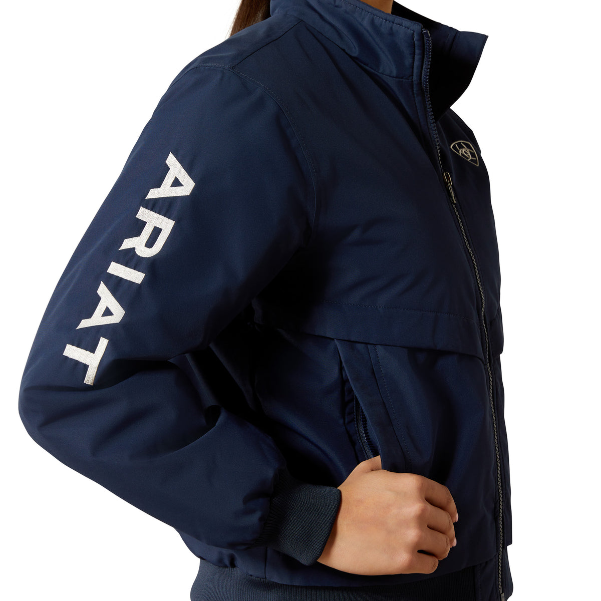Navy jacket with 'Ariat' branding on a white background