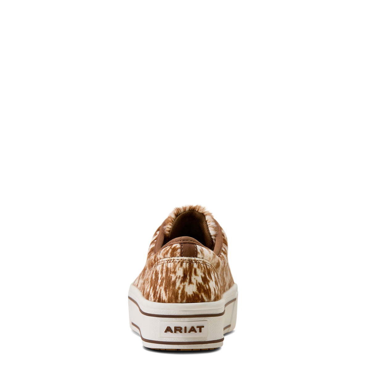 Brown and white cow print sneaker with 'Ariat' branding on a white background