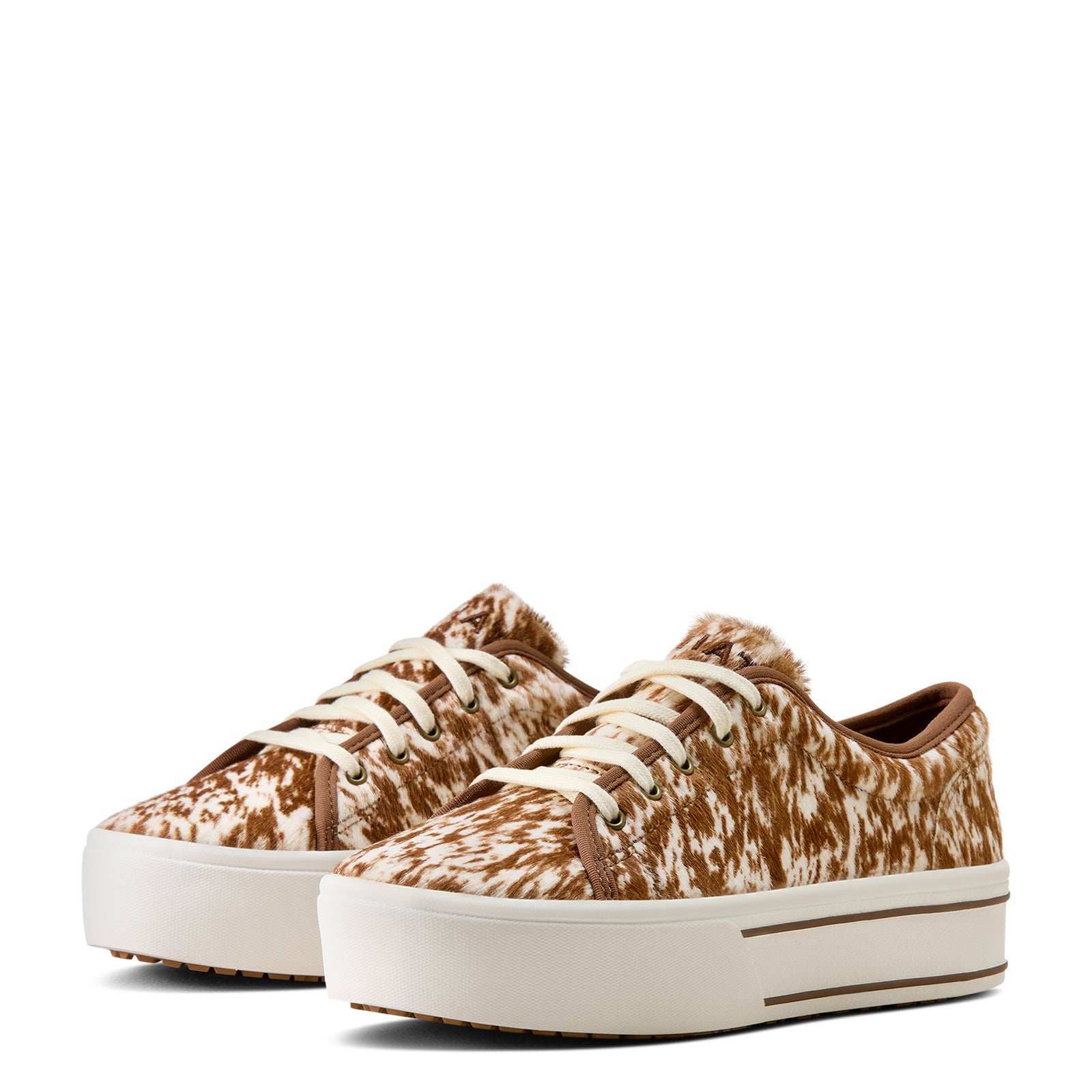 Pair of brown and white patterned sneakers on a white background