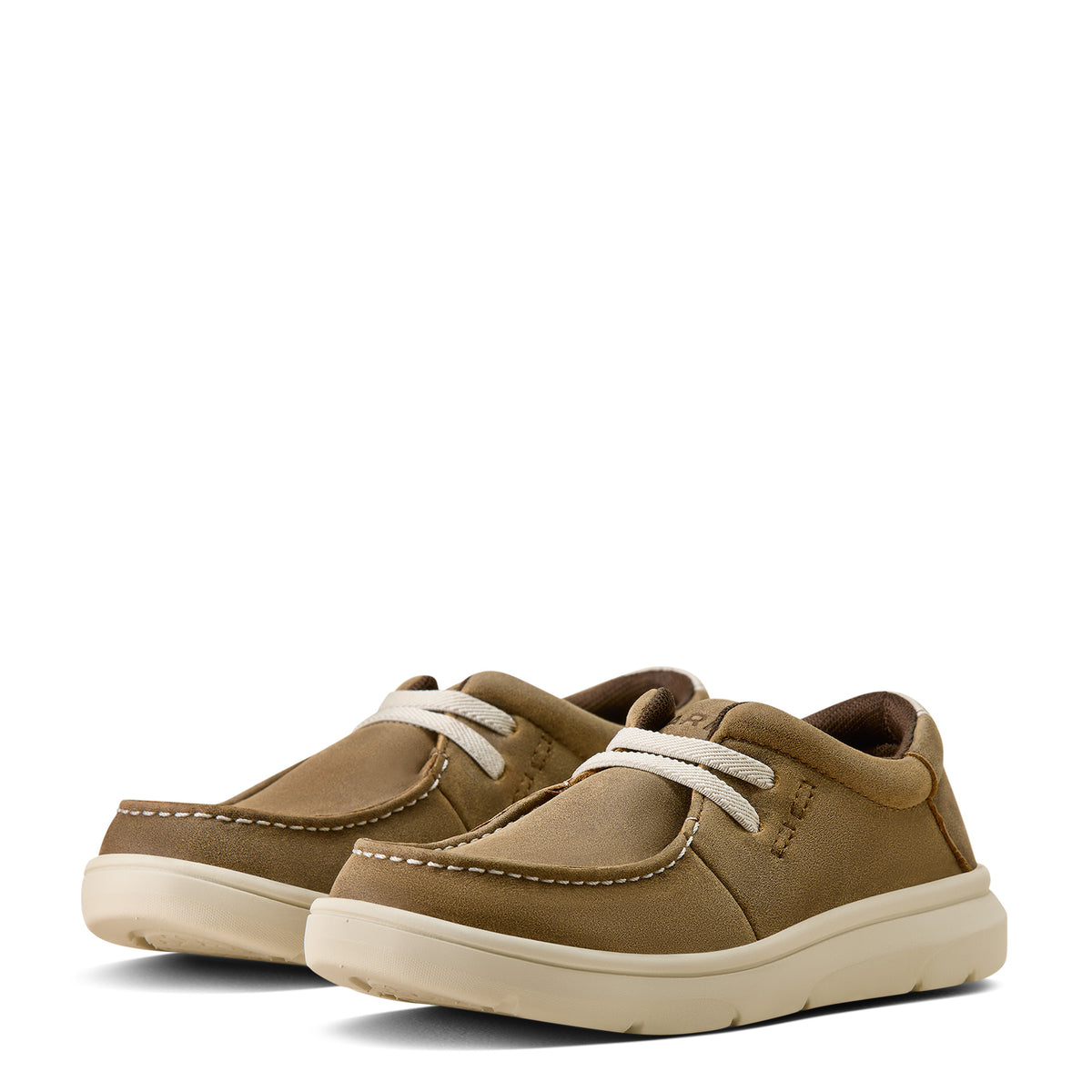 Pair of tan children's shoes with white laces on a white background