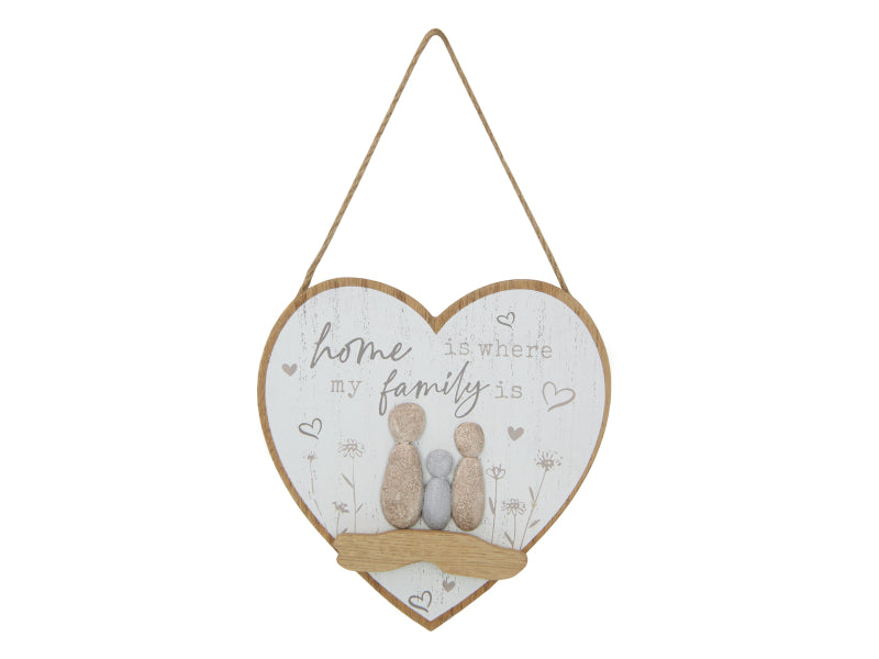 Heart Shape Family Hanging Plaque with Rock Family. Heart-shaped hanging sign with 'home is where my family is' text and two small figures on a white background.