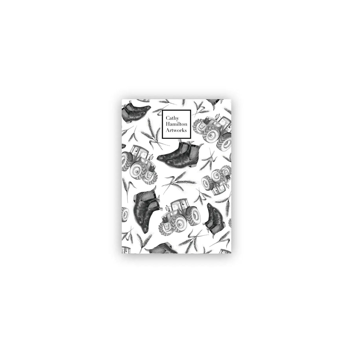 Farmers A6 Notepad. A black and white image of an A6 notepad with a farm-themed pattern including boots and farm equipment.