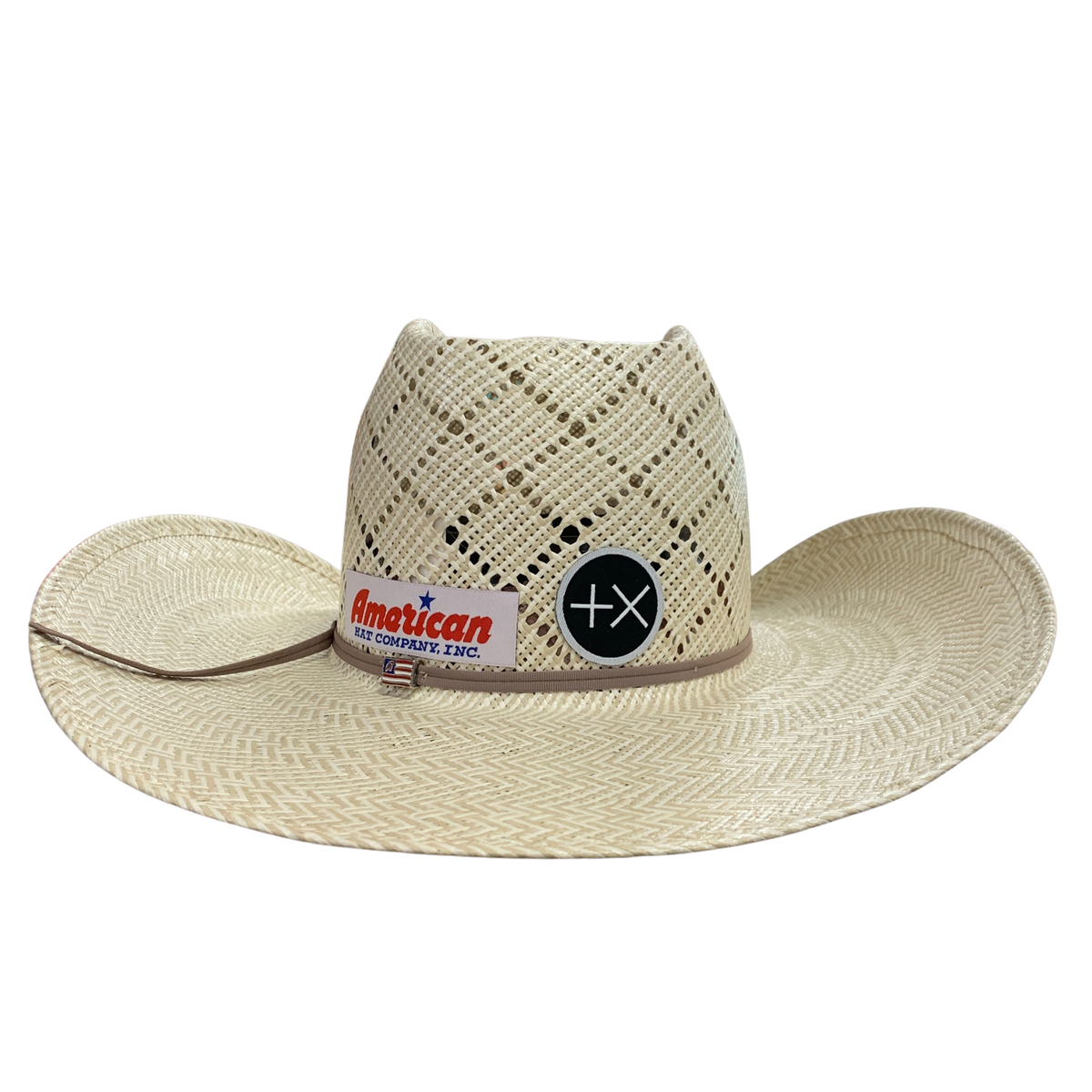 A woven straw cowboy hat in a light beige color, featuring a structured crown with a diamond lattice pattern, a wide brim, and a band with a 'American' logo patch.