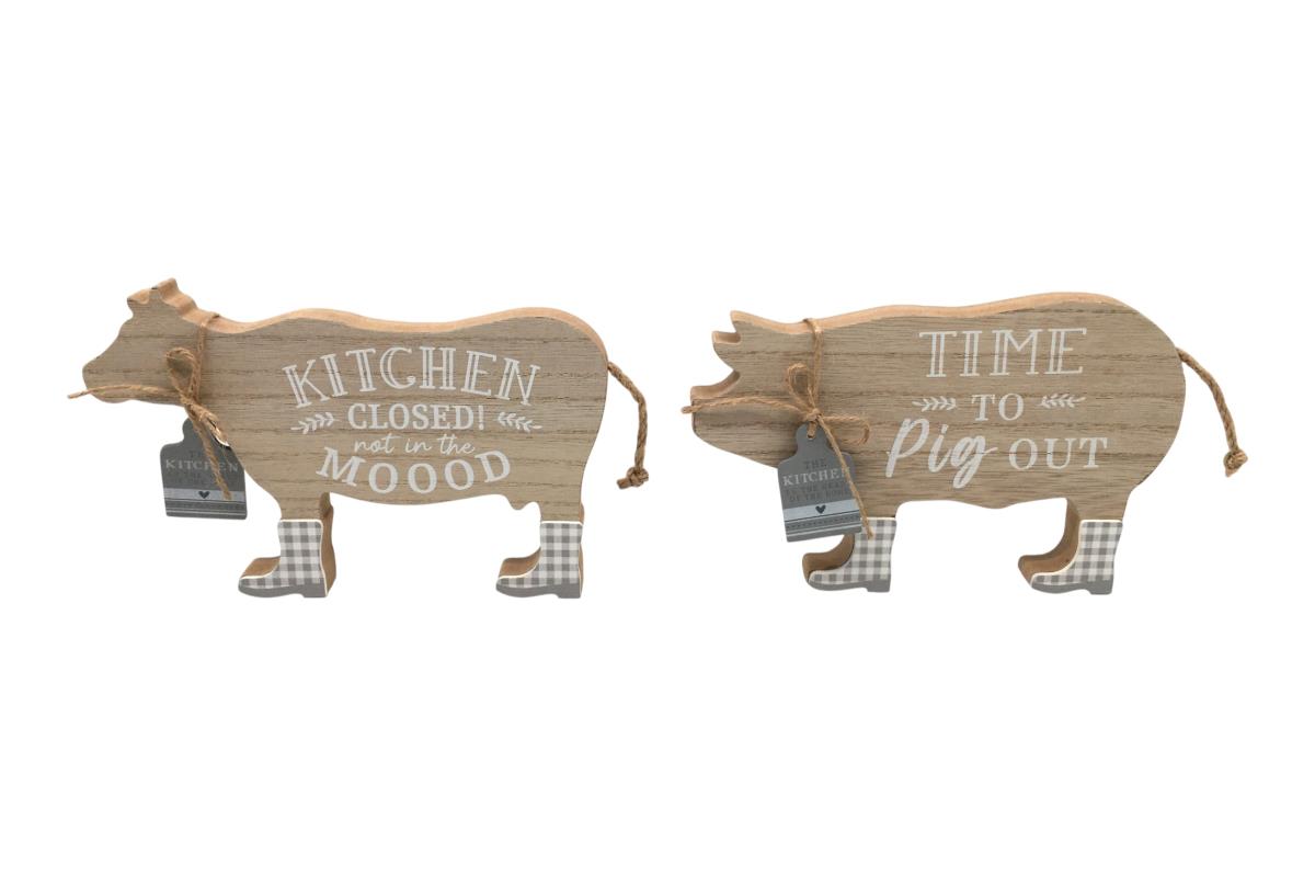Two wooden pig-shaped signs with humorous sayings on a white background
