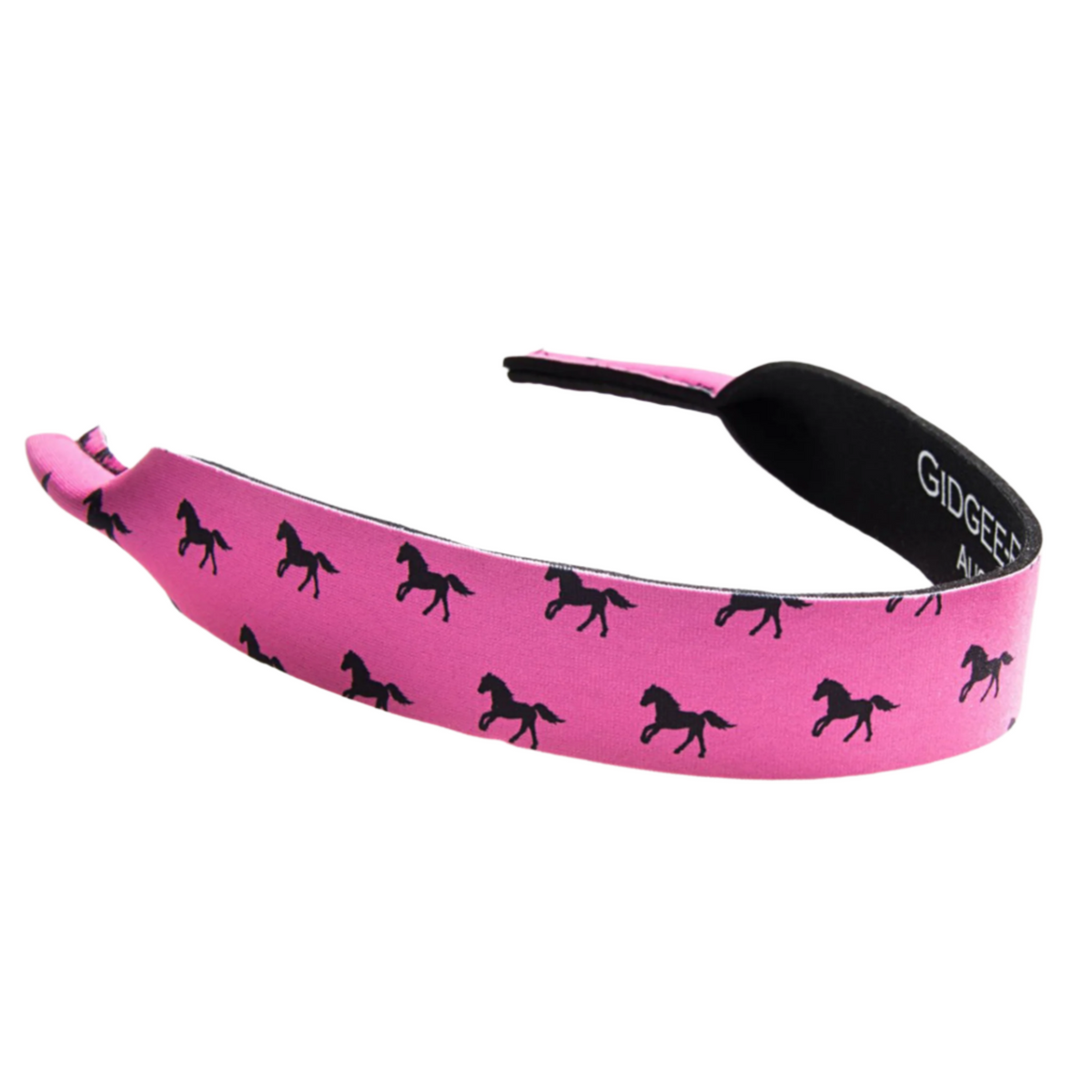 Gidgee Eyes Pink Pony Print Sunglasses Strap. Pink headband with black horse pattern and black band labeled &#39;Gidigee&#39; on a white background