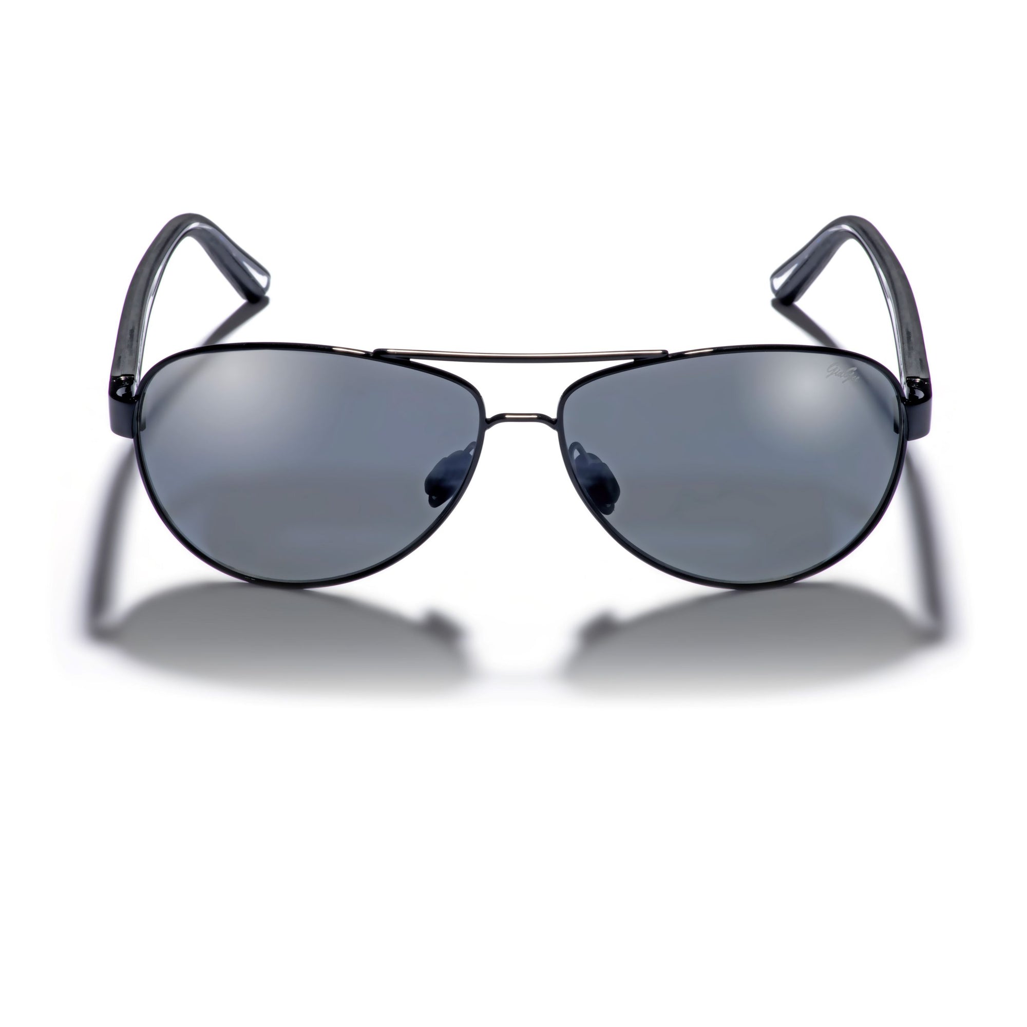 Gidgee Eyes Equator Blaze Sunglasses. A pair of Gidgee Eyes Equator Blaze Sunglasses with a black metal wire frame and grey tint on the lenses, displayed on a white background.