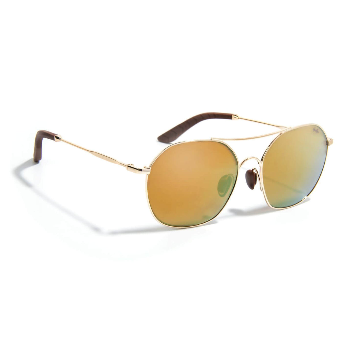 Gidgee Eyes Cadence Gold Sunglasses. A pair of gold-colored Gidgee Cadence Gold sunglasses with a reflective orange lens, showcasing the side profile of the sunglasses with the arm down.