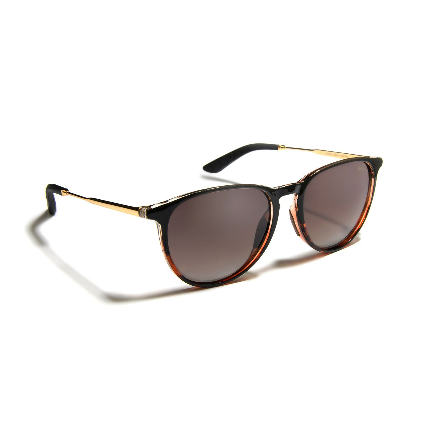 Gidgee Eyes Charisma Ombre Sunglasses. A pair of Gidgee Eyes Charisma Ombre Sunglasses with a two-tone black and honey bee tortoise frame, featuring a natural brown gradient injection polarised lens.