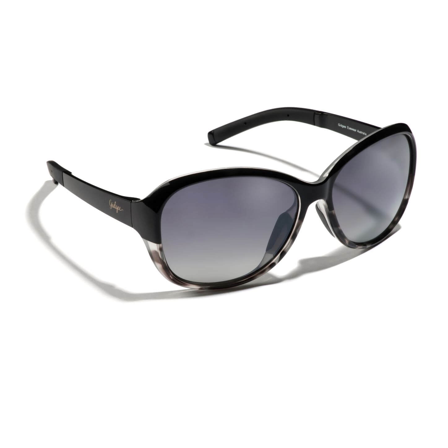Gidgee Eyes Willow Dapple Sunglasses. A pair of Willow Dapple sunglasses featuring a two-tone black and grey dapple tortoise frame with polarized lenses.