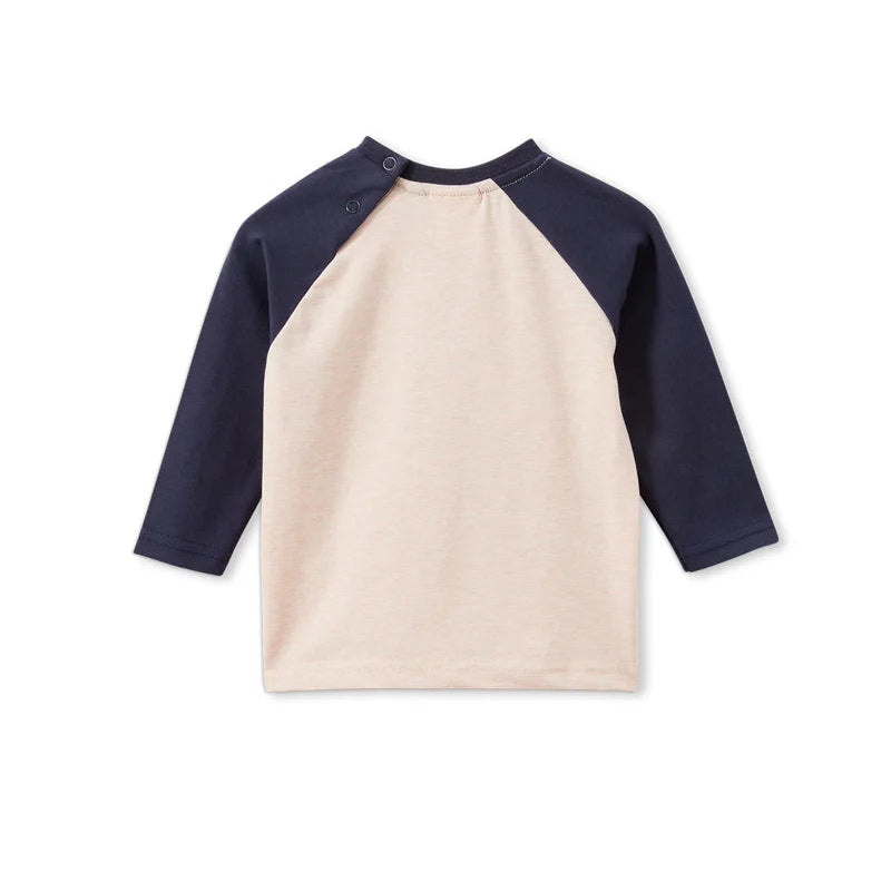 Children's shirt with navy sleeves and beige body on a white background