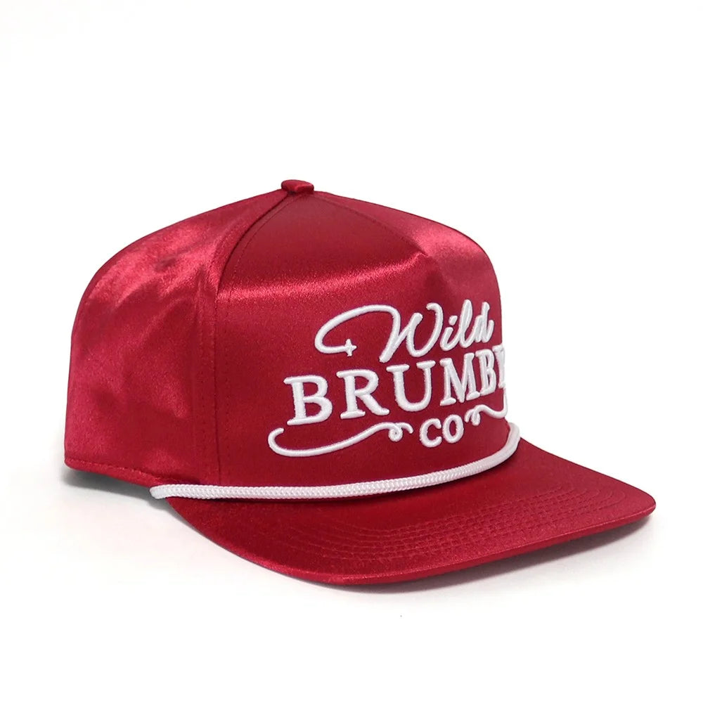 Red satin cap with white text on a white background