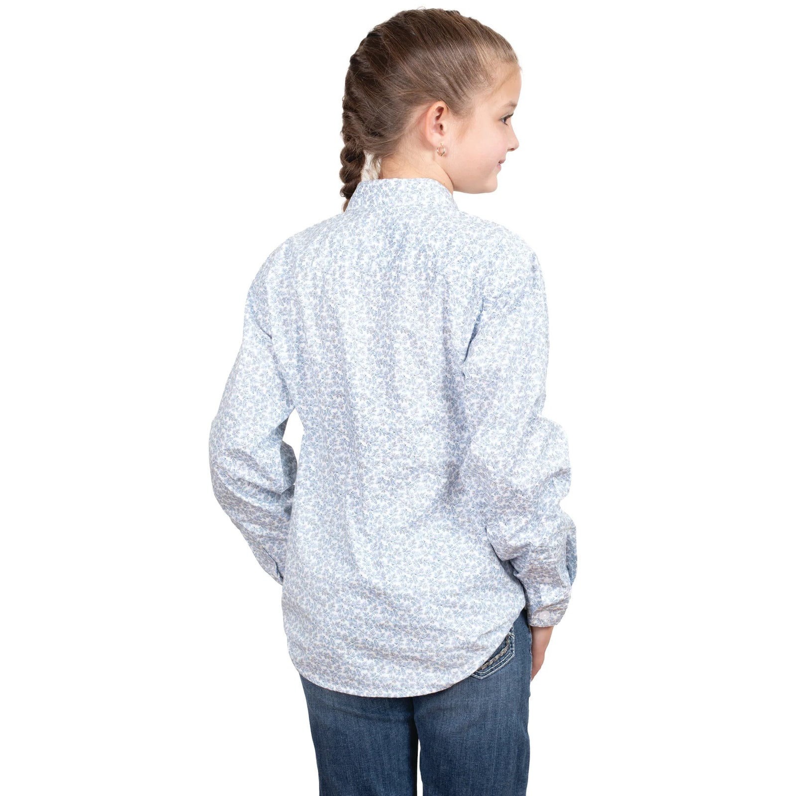 Just Country Girl's Harper Half Button L/S Shirt. A girl wearing a long-sleeved, half-buttoned shirt with double pockets, in a floral pattern, standing against a white background.