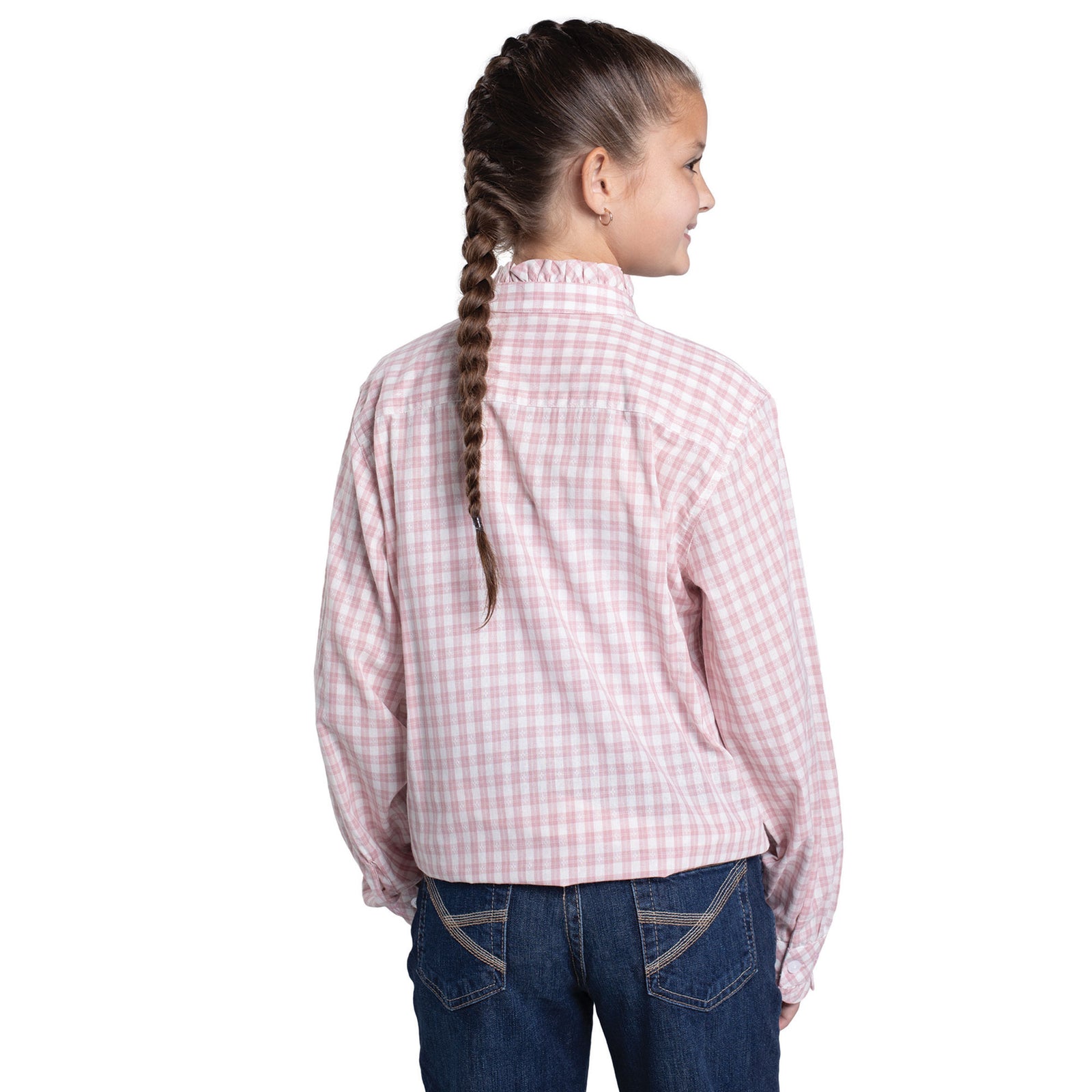 Child wearing a pink checkered shirt and blue jeans on a white background