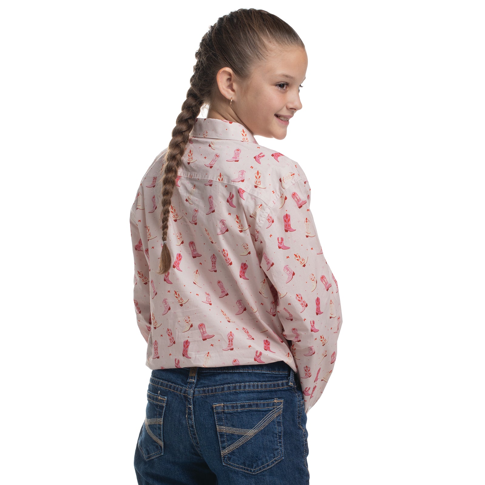 Girl wearing a patterned shirt and jeans on a white background