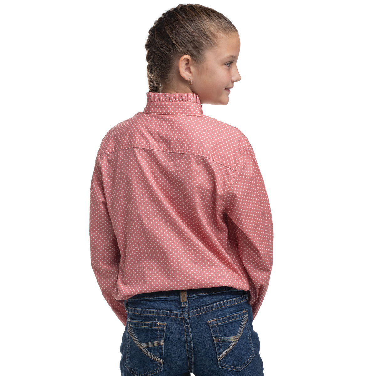 Girl wearing a red patterned shirt and blue jeans on a white background