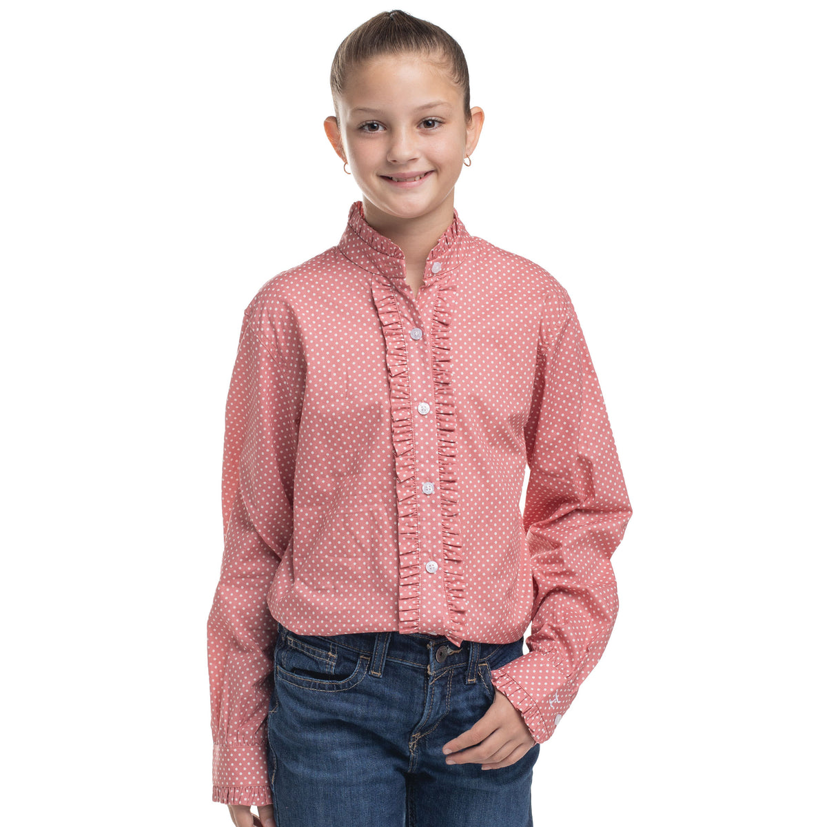 Young girl wearing a pink patterned shirt and blue jeans on a white background