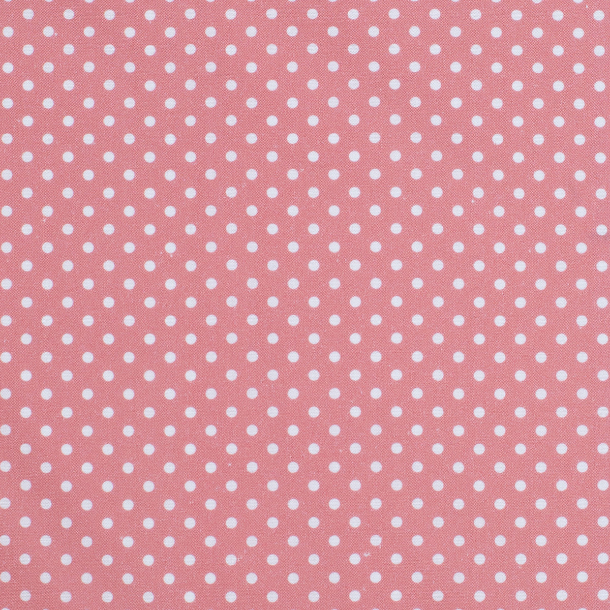 Pink fabric with white polka dots