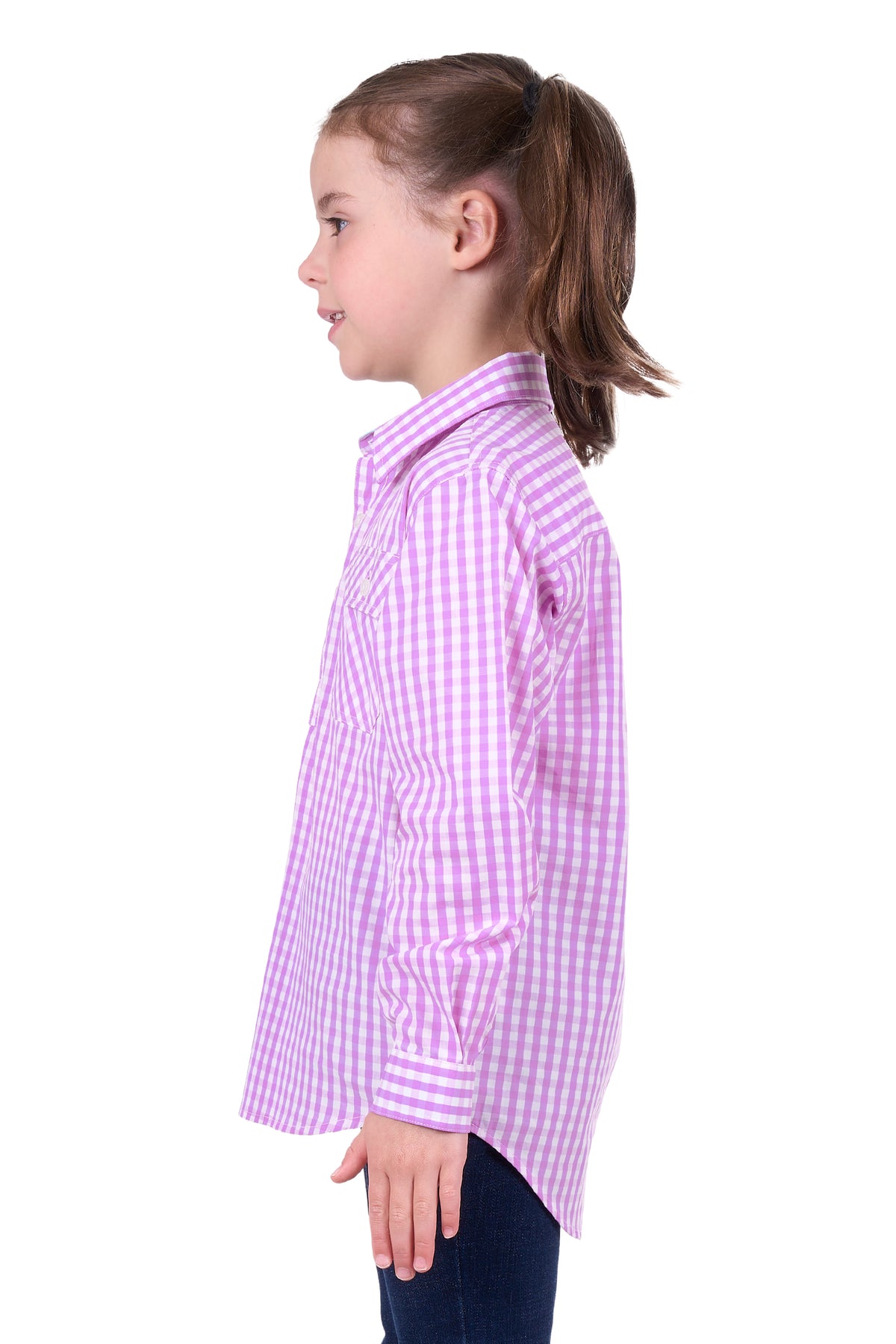 Hard Slog Girl's Ayla 1/2 Placket L/S Shirt. A girl wearing a long sleeve purple checkered shirt with a collar and front chest pocket.