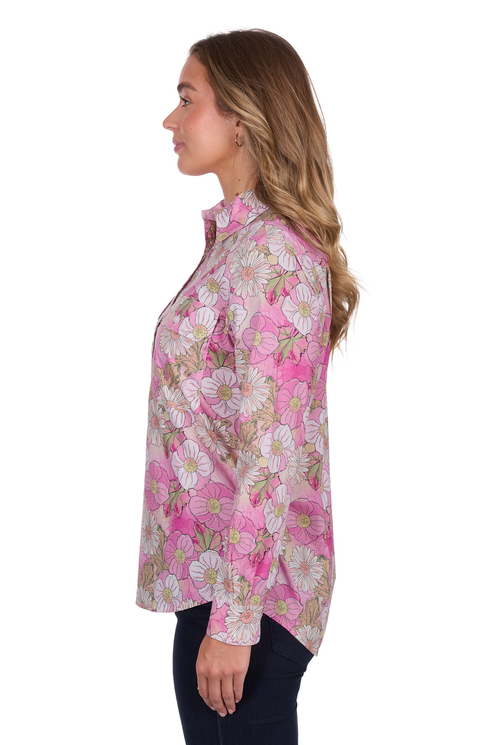 Hard Slog Women's Etta 1/2 Placket L/S Shirt. Woman wearing a pink floral blouse on a white background