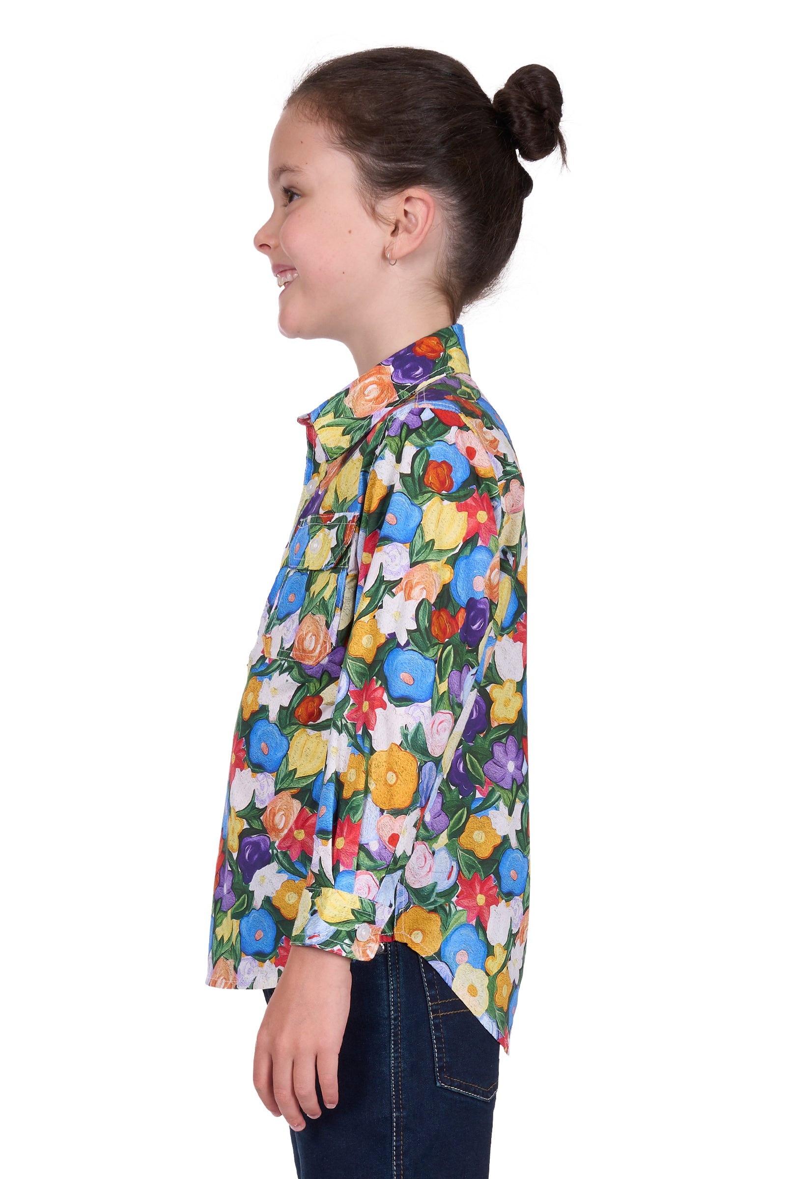 Hard Slog Girl's Delia 1/2 Placket L/S Shirt. Girl wearing a colorful floral shirt on a white background