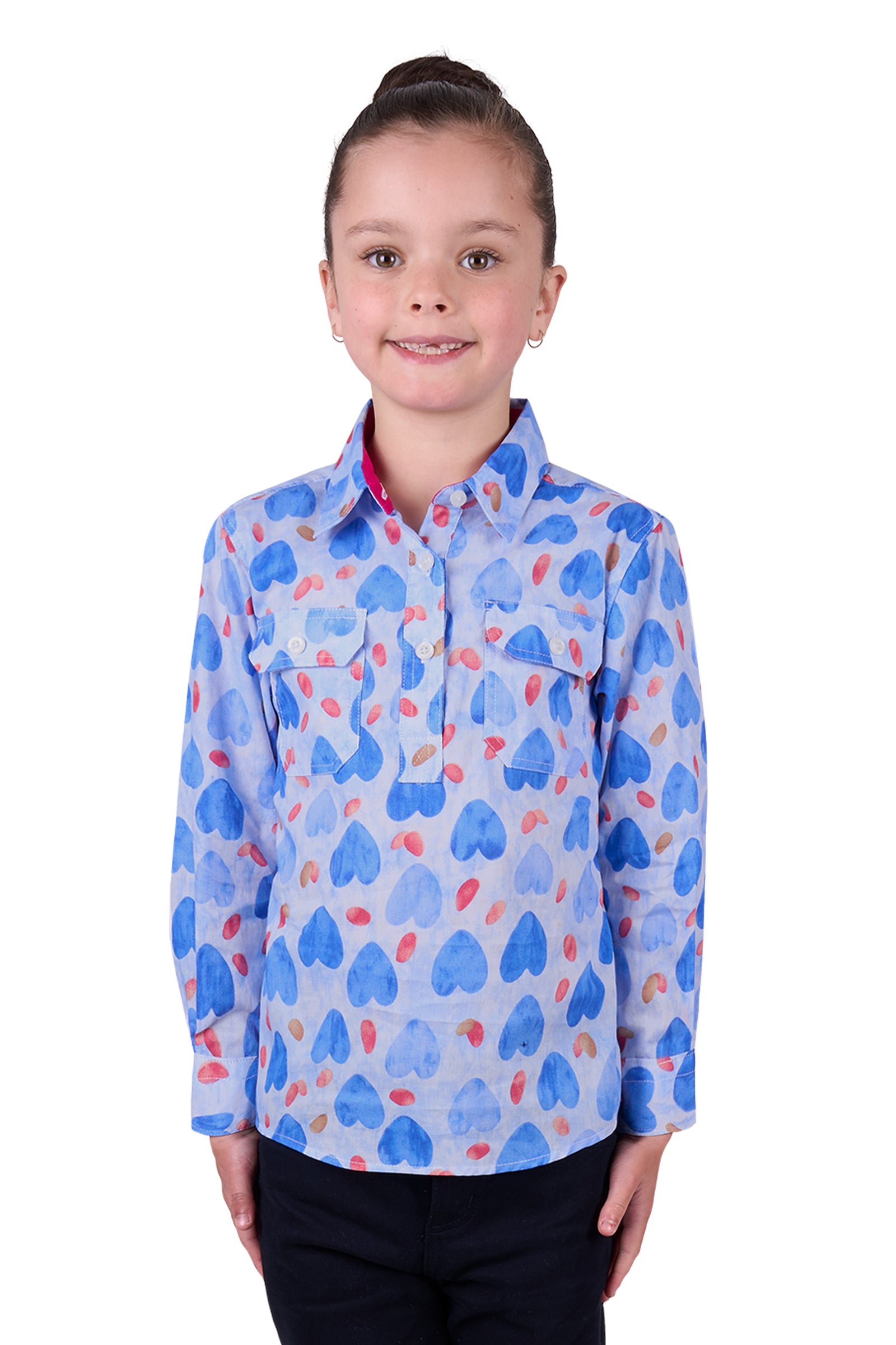 Hard Slog Girl's Miv 1/2 Placket L/S Shirt. A girl wearing a long sleeve shirt with a geometric heart pattern, predominantly blue with red and white accents, and a half placket collar.