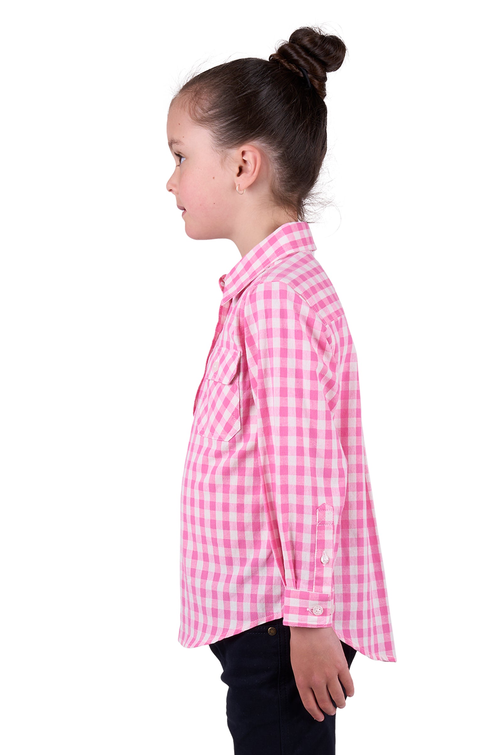 Hard Slog Girl's Melly 1/2 Placket L/S Shirt. A girl wearing a long sleeve pink checkered shirt with a half placket and two front pockets.