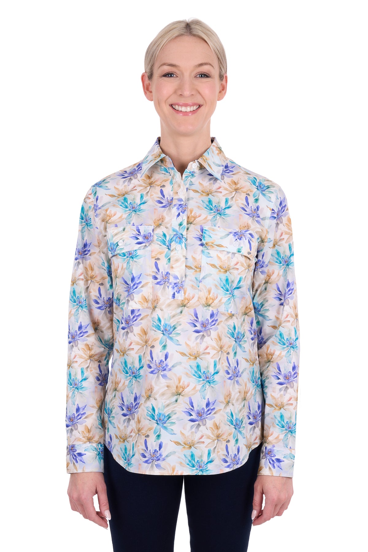 A woman modeling a long-sleeve button-up shirt with a blue, purple, and beige floral pattern on a white background.