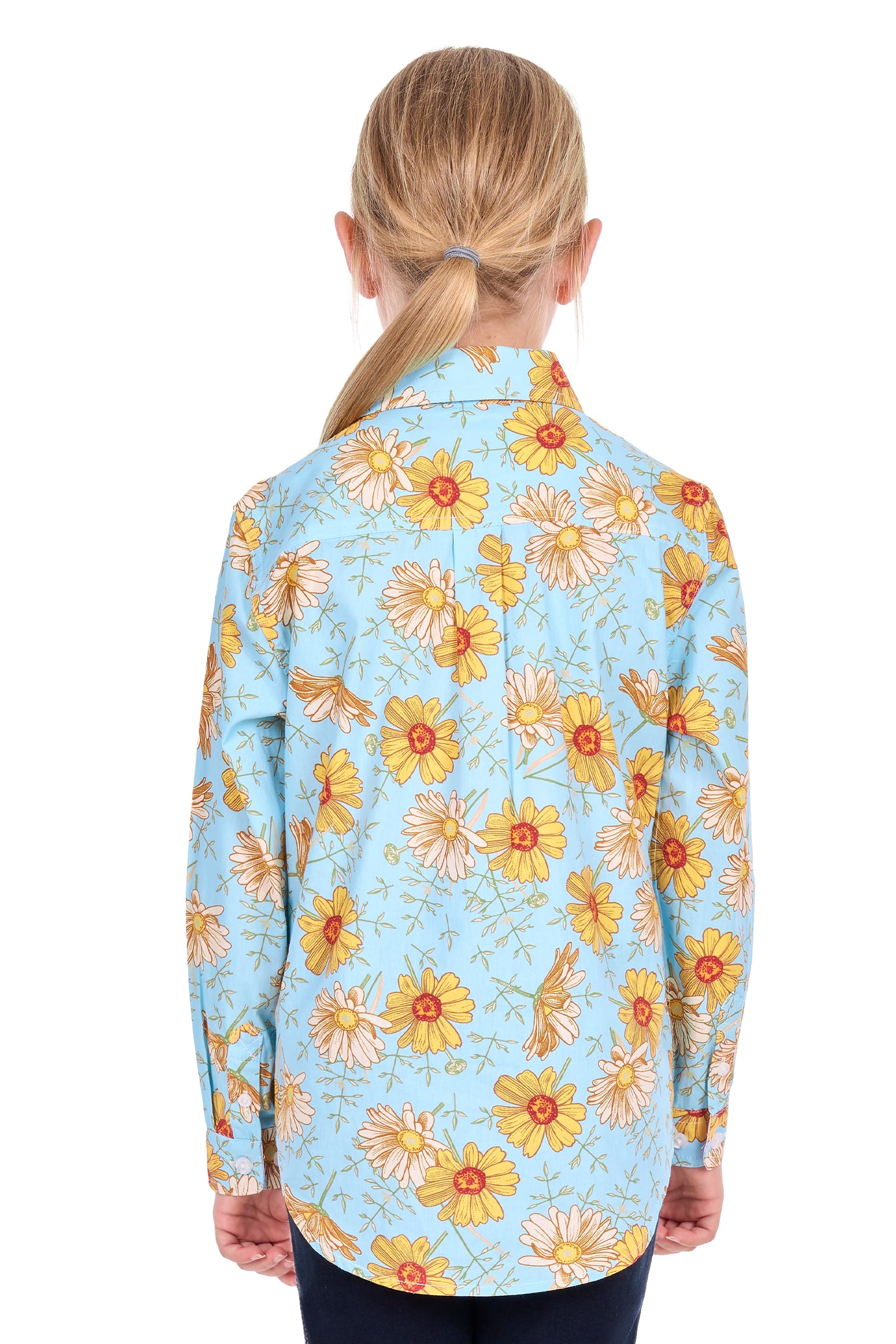 A child viewed from the back wearing a light blue long-sleeve button-up shirt with a yellow and orange floral print, paired with dark pants, against a plain white background.