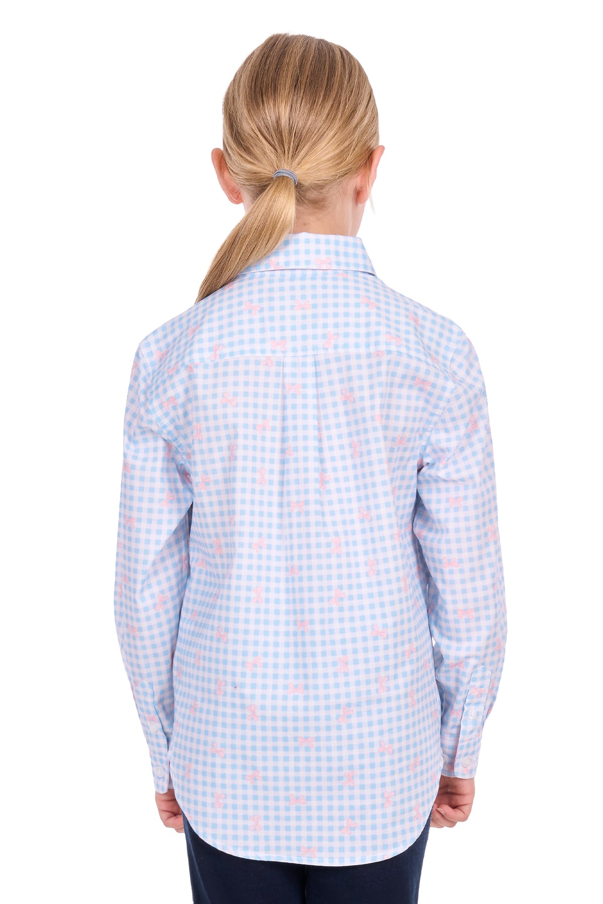 A child model shown from the back wearing a light blue and white gingham long-sleeve shirt with a small pink bow pattern, paired with dark navy pants, against a solid white background.