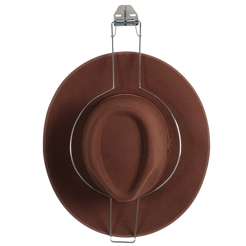 The Hat Saver. Brown felt hat on a metal stand against a white background