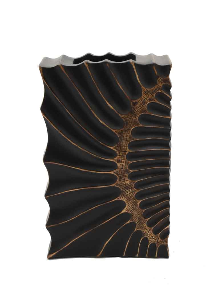 Decorative vase with black and gold pattern on a white background