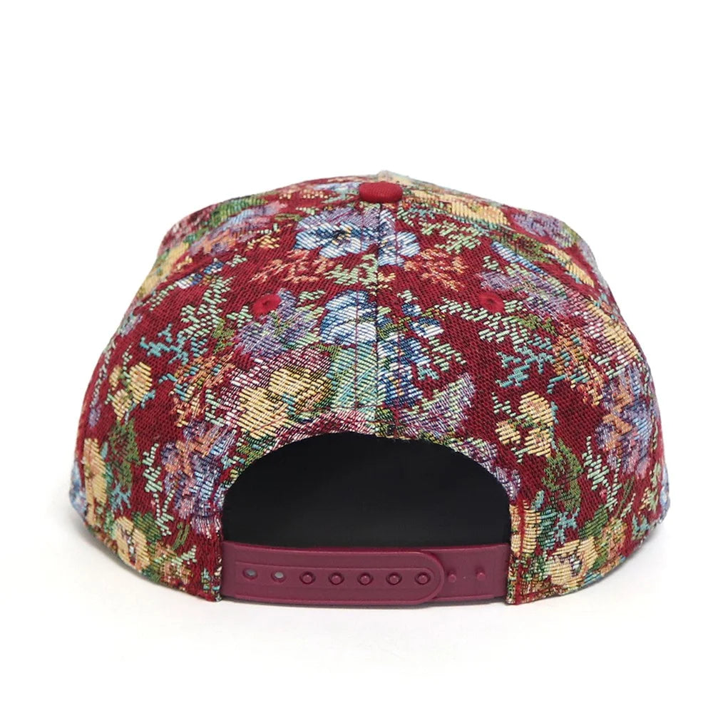 Colorful floral-patterned cap on a white background