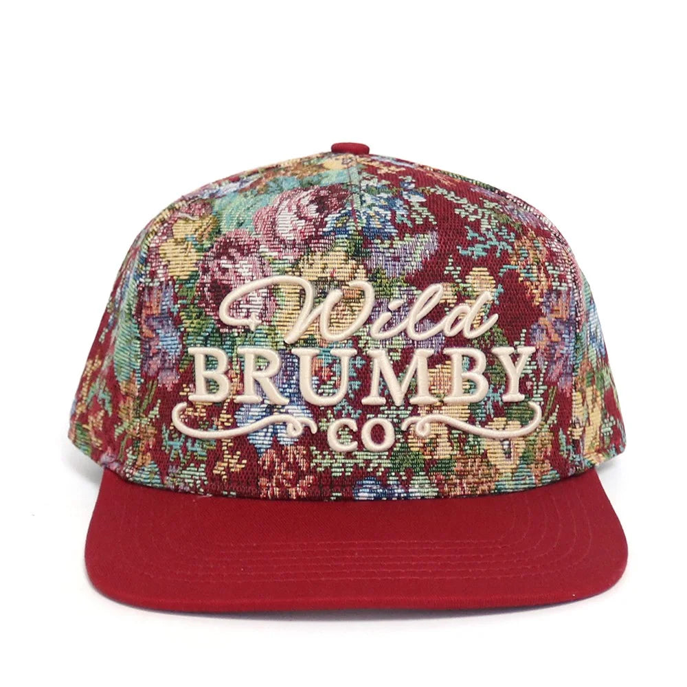 Floral-patterned cap with 'Wilt Brumby Co' text on a white background