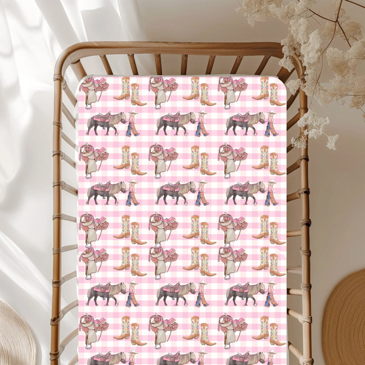 Patterned pink and white checkered fabric with cowboy boots and horses on a wooden chair.