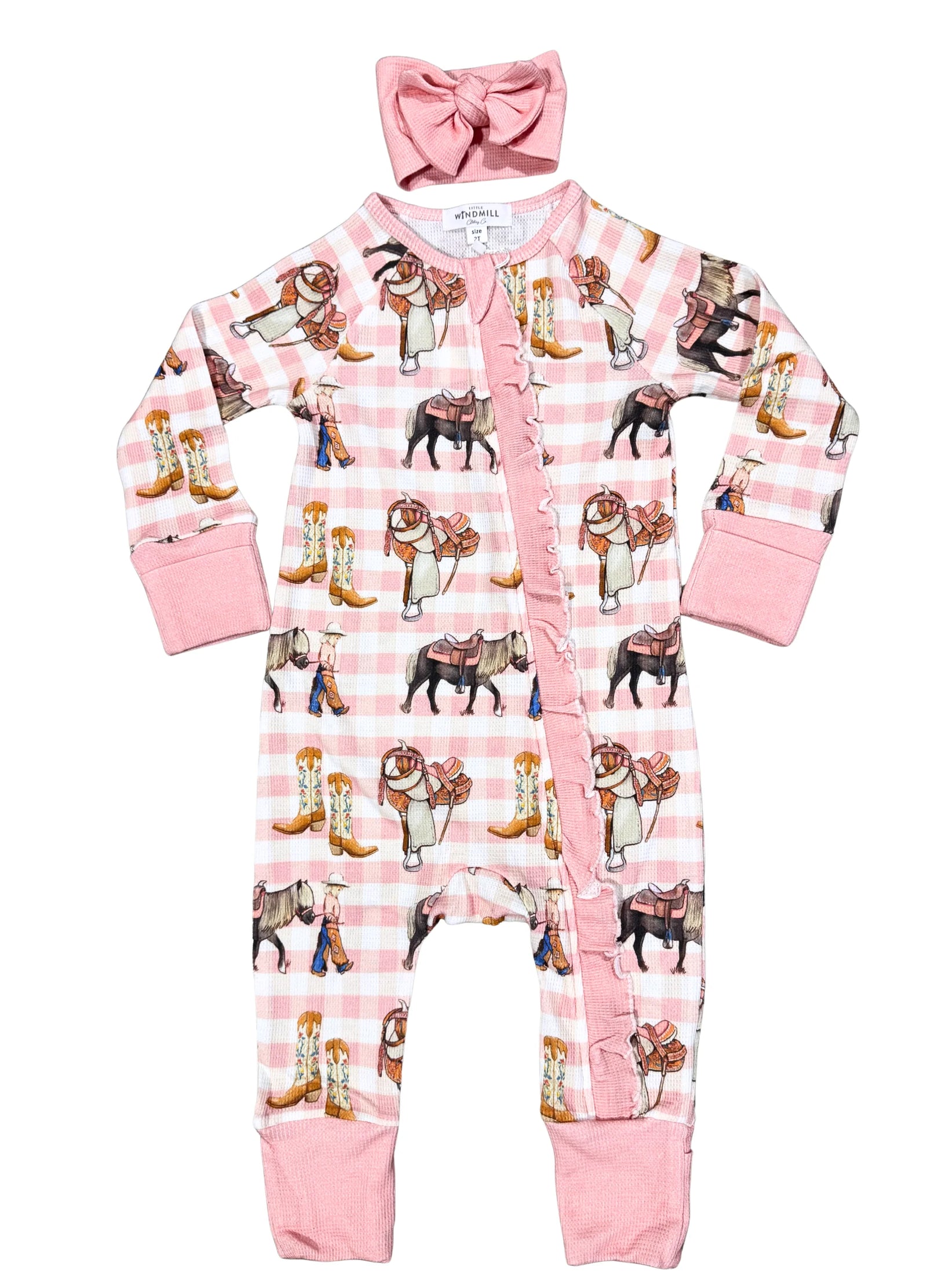 Baby romper with bulldog and cowboy boot pattern on pink background, accompanied by a matching headband.