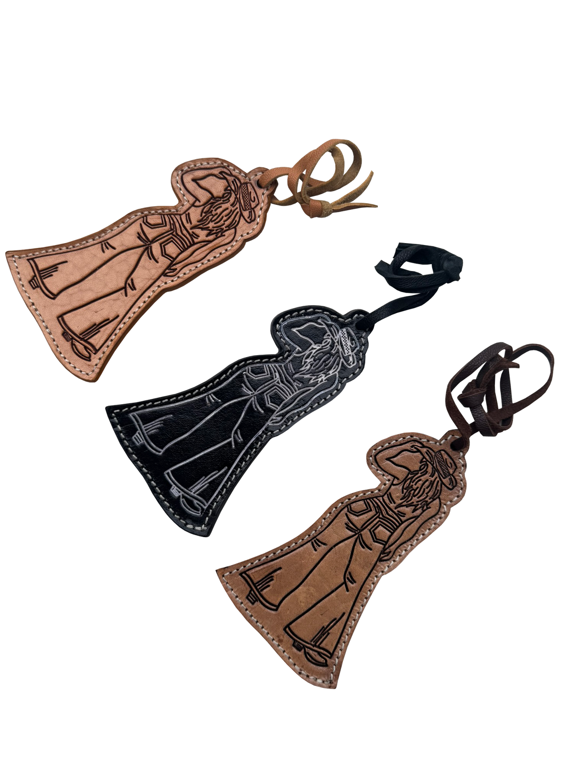 Three leather cloaked figure keychains or bag charms with embroidered figures, shown on a plain white background in brown, black, and tan colors.