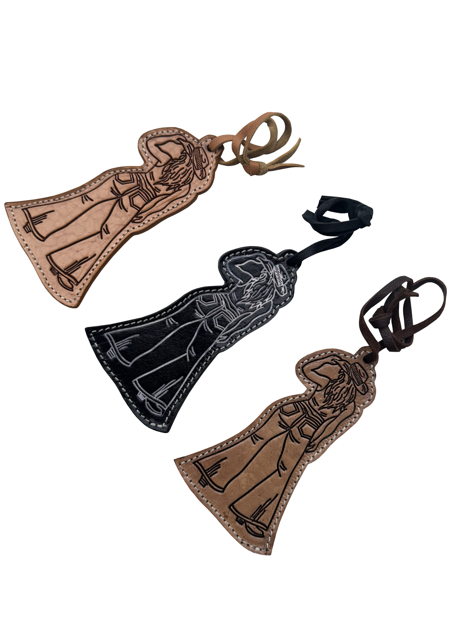 Three leather cloaked figure keychains or bag charms with embroidered figures, shown on a plain white background in brown, black, and tan colors.