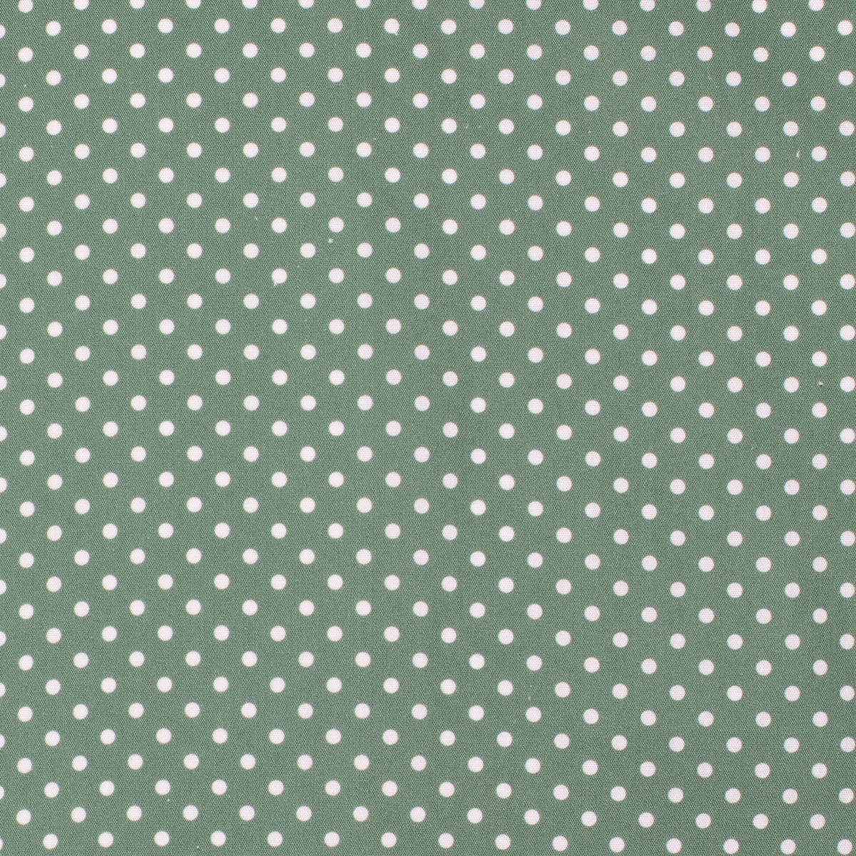 Green fabric with white polka dots