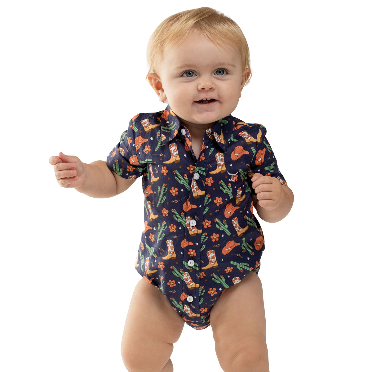 Baby wearing a colorful patterned onesie on a white background