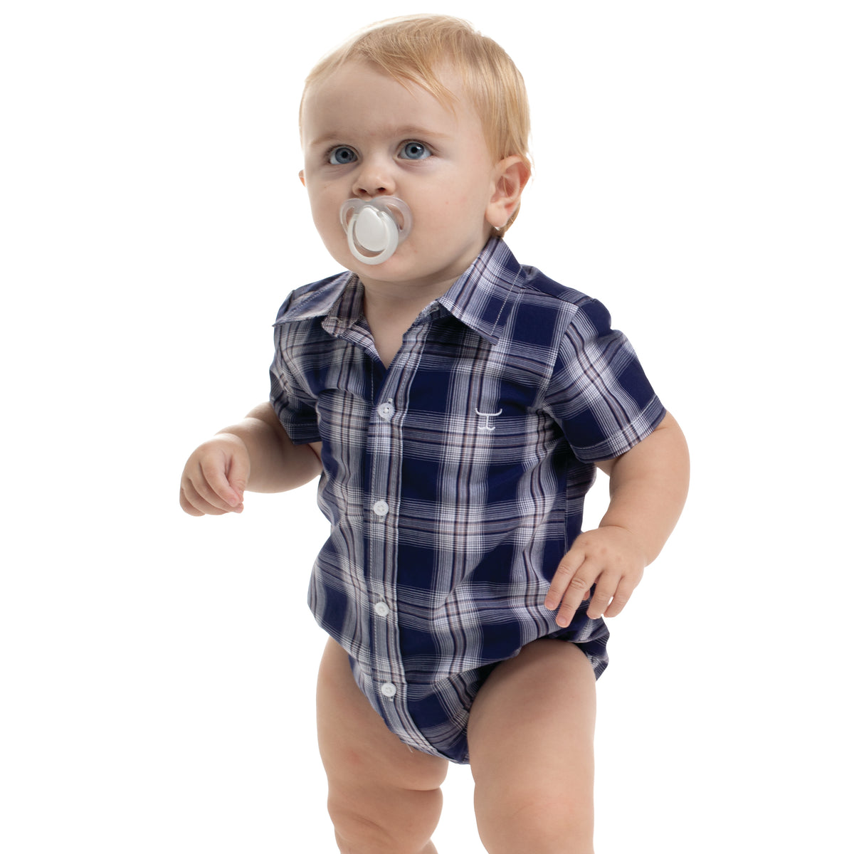 Baby wearing a blue plaid shirt and diaper with a white background