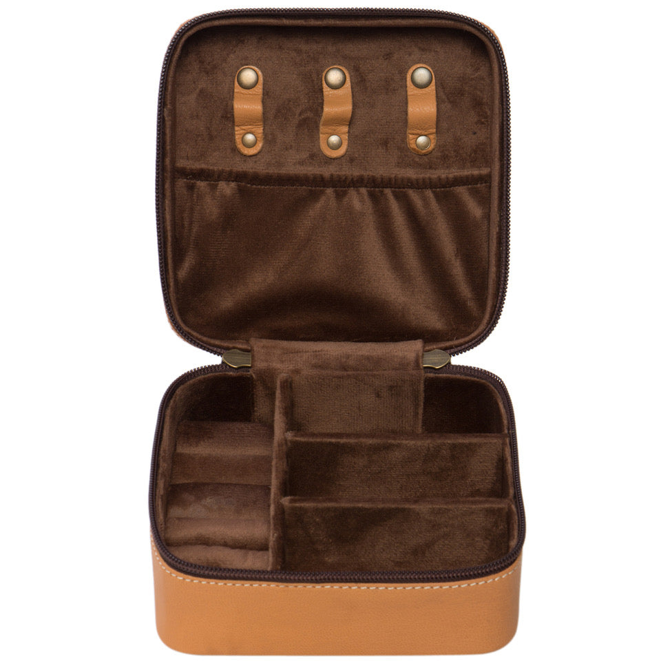 Tooling Cowhide Jewellery Box. Brown leather case with intricate patterns and a cowhide panel on a white background